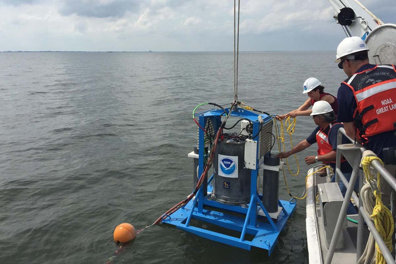 A machine being lowered into the water