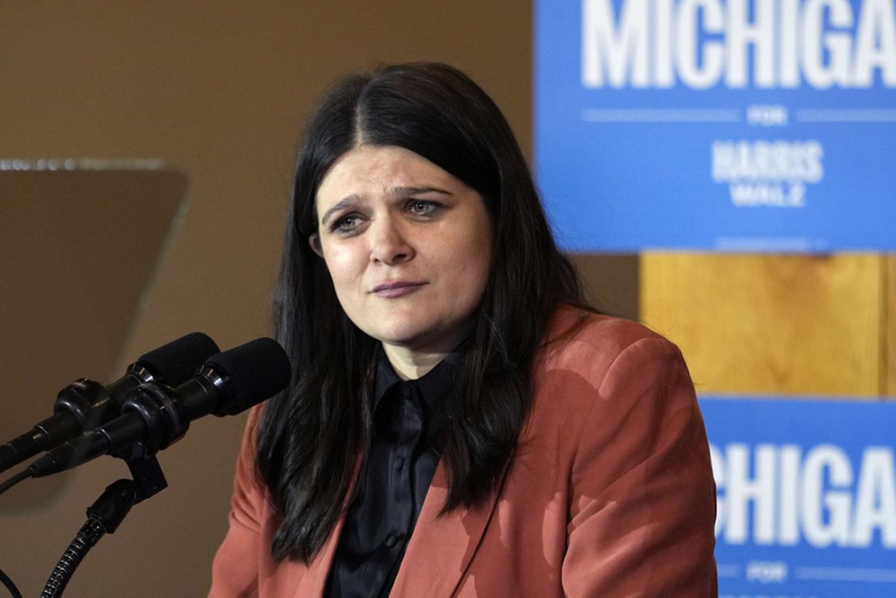 Michigan US Rep. Haley Stevens speaking into microphone.