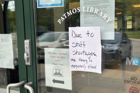 A sign stating the Patmos Public Library is closed due to a staff shortage.