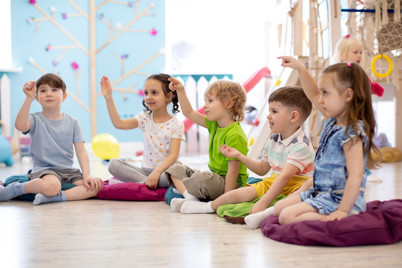 preschoolers sitting on the floor