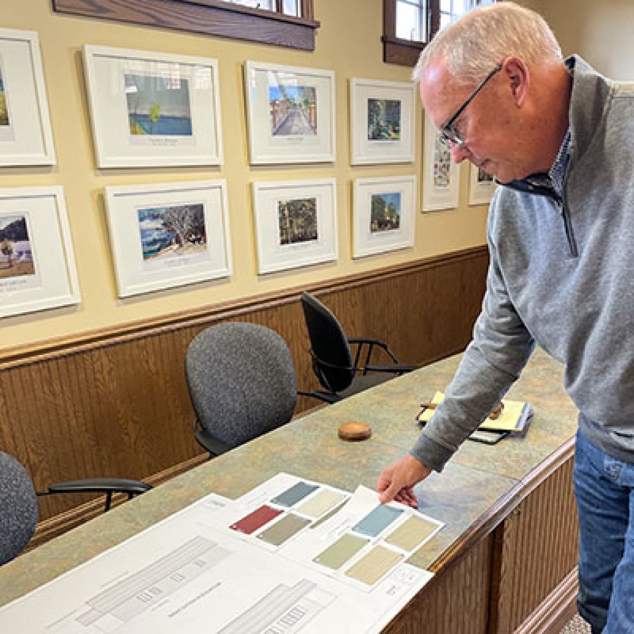 Jay White looking at site plans