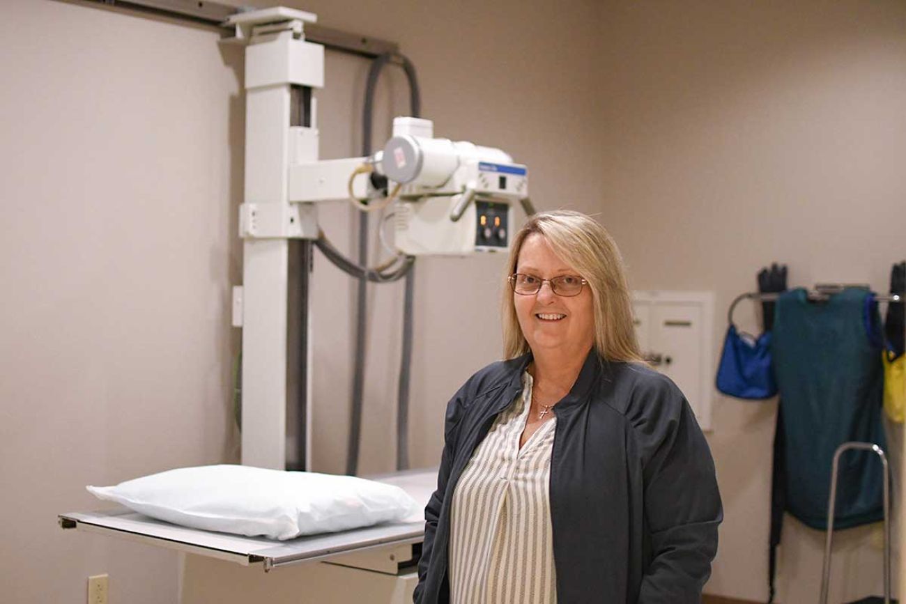 Kelly Parish posing for a picture in a medical facility 