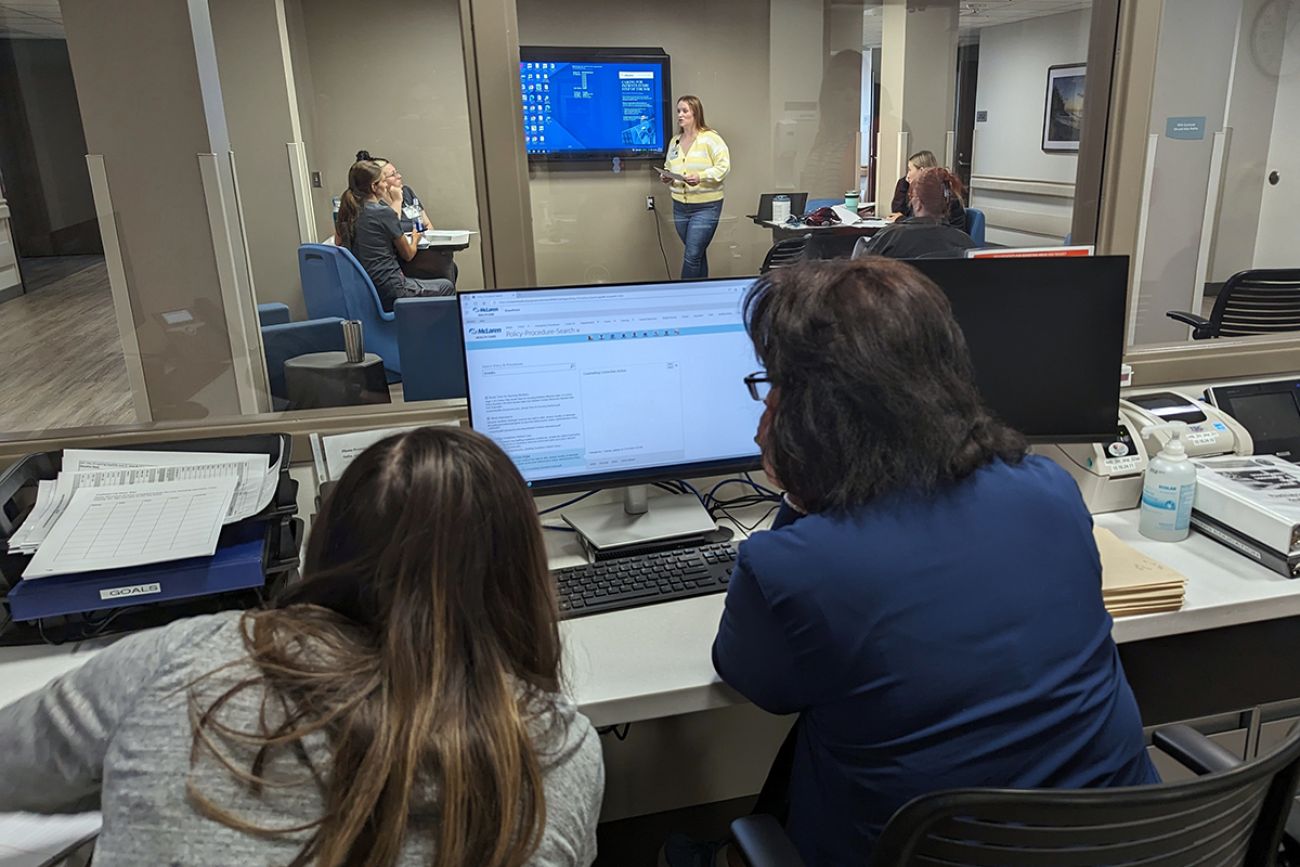 two people looking at a computer