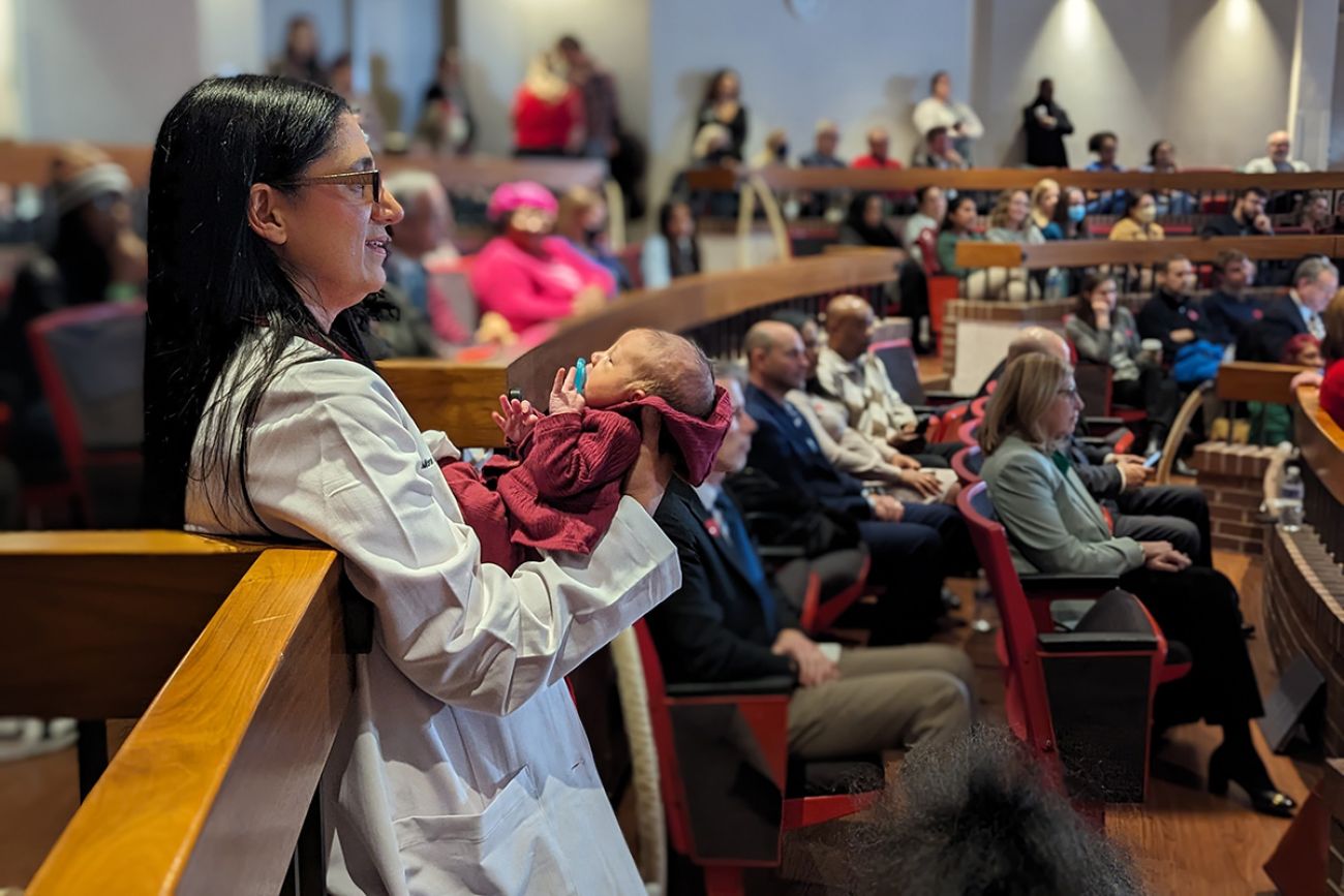 Dr. Mona Hanna-Attisha holds baby