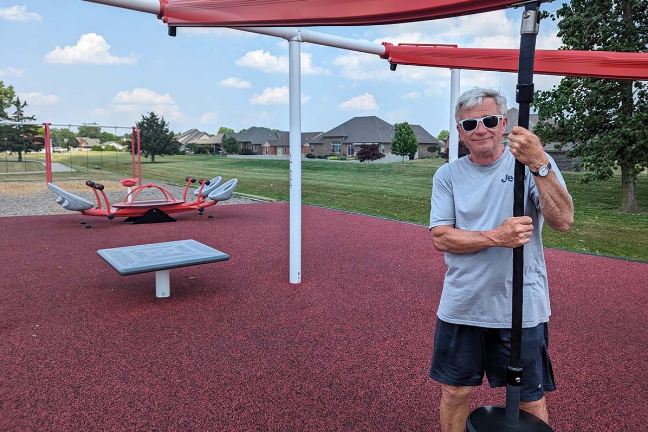 Monroe Township Supervisor Alan Barron standing a playground