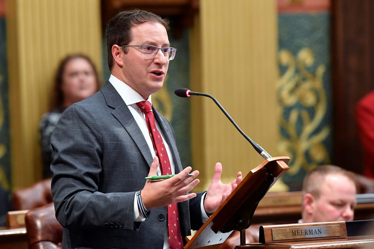 State Rep. Graham Filler, R-Duplain Township, speaks into a microphone