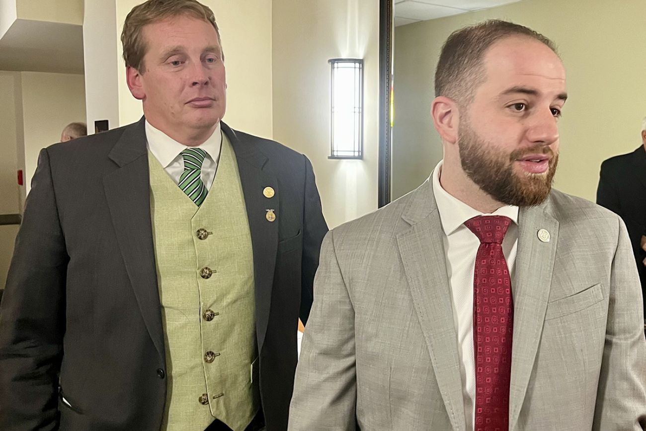 Republican Sen. Ed McBroom and Democratic Sen. Jeremy Moss stand next to each other