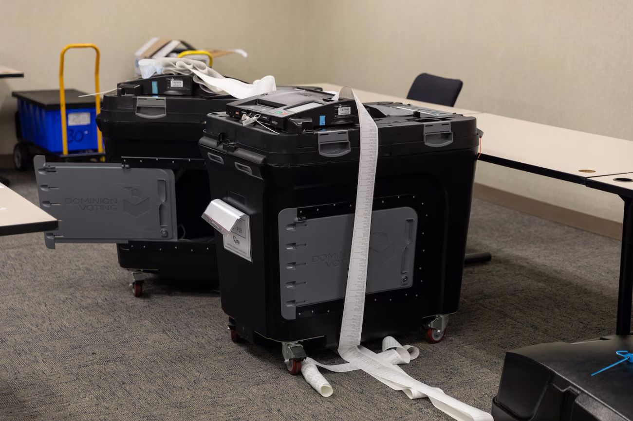 A black tabulator with tape coming out of it. 