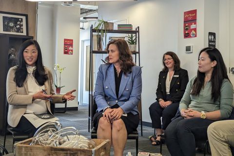 Gov. Gretchen Whitmer sitting down in a panel