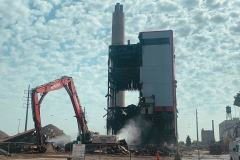 truck taking down building