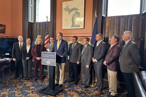 Senate Minority Leader Aric Nesbitt, R-Porter Township, speaks at a podium 