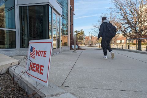 Vote here sign on Michigan State University's campus 