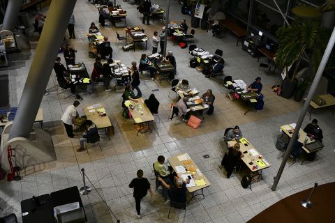 An aerial view of poll workers counting ballots at the end of Election Day at City Hall in Warren