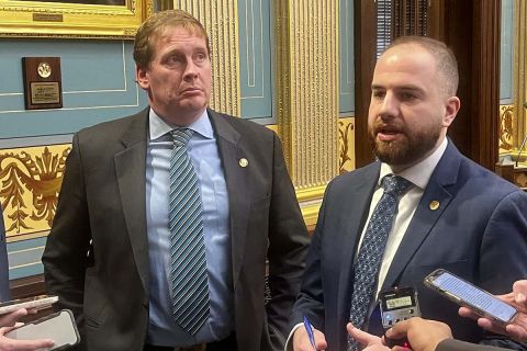 Republican state Sen. Ed McBroom, left, and Democratic Sen. Jeremy Moss stand next to each. They are talking to reporters.