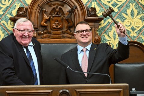 Michigan House Speaker Matt Hall, R-Richland Township, holding up a gavel 