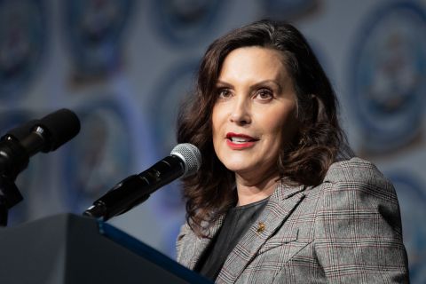 Michigan Gov. Gretchen Whitmer speaks into a microphone. 