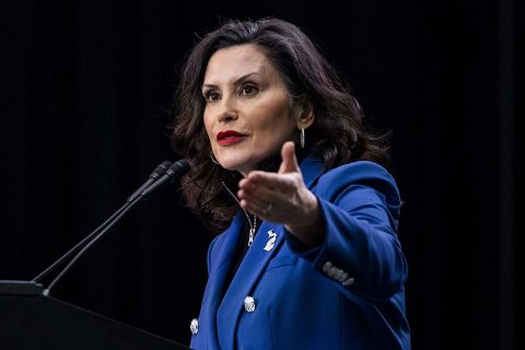 Gov. Gretchen Whitmer speaks into a microphone. 