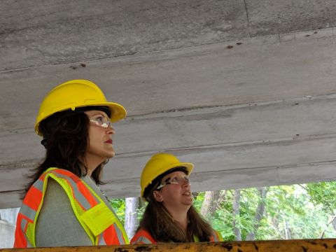 Gov. Gretchen Whitmer with a yellow hard hat. 