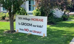 sign in front of a yard