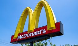 McDonald's burger fast food restaurant. Sign, logo, angle view